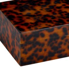 an animal print box is shown on a white background