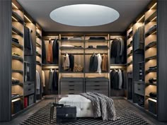 a large walk - in closet with lots of clothes on the shelves and drawers,