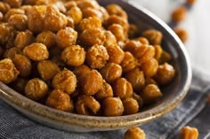 a bowl filled with nuts sitting on top of a table