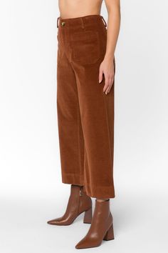 Made from a soft and cozy corduroy fabric, these pants are perfect for Autumn days. The cropped wide-leg silhouette flatters all body types, while the button zip closure and front patch pockets add a touch of utility-chic style. Material: 98% Cotton and 2% Spandex Machine wash cold Color: Copper Model is 5'9" and wearing a size S Imported Copper Pants, Autumn Days, Corduroy Fabric, New Tops, Cami Tanks, Corduroy Pants, Jacket Sale, Jacket Outfits, Sweater Jacket