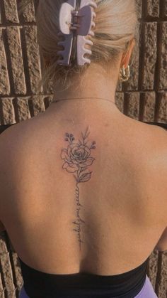 a woman with a tattoo on her back