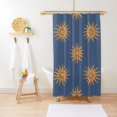 a blue shower curtain with yellow sunflowers on it