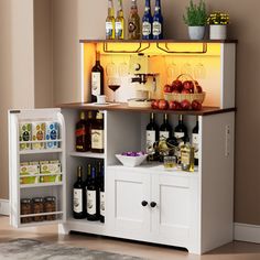 an open refrigerator with wine bottles and other items on it's shelves in a living room