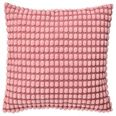 a pink pillow that has been made out of small, round beads on the front