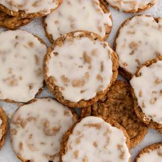 several cookies with white icing and sprinkles