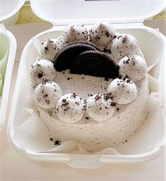 an oreo cake in a plastic container on a table