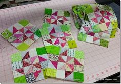 the quilts are laid out and ready to be sewn together on the table