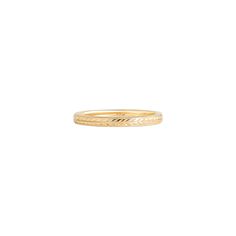 a yellow gold wedding ring with an arrow design on the side and a thin band