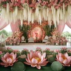 an outdoor wedding setup with pink flowers and greenery