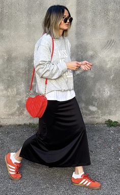 Jeans And Trainers Outfit Winter, Long Skirt Outfit With Sneakers, Black Skirt With Sneakers Outfit, Icelandic Street Style, Adidas Skirt Outfit Street Styles, Midi Skirt And Trainers Outfit, Dr Martens And Skirt Outfit, Plane Outfit Airport Style Comfy Summer, Red Sneakers Outfit Women Street Style