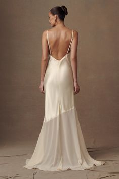 the back of a woman in a white dress