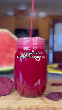 a pink mason jar filled with watermelon juice