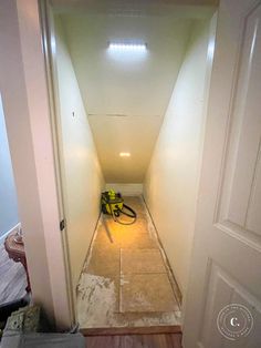 an empty hallway with a blow dryer on the floor