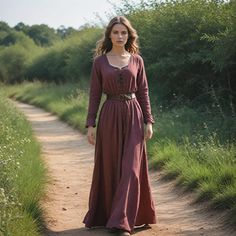 This rustic brown Viking-inspired dress captures the essence of medieval and Renaissance fashion. This gown is perfect for reenactments, festivals, and cosplay events. The lace-up front and leather belt add a historical touch, making this outfit ideal for anyone seeking an authentic Viking look. Comfortable for long days at festivals, this versatile gown offers both practicality and style, perfect for any history lover or event attendee. Whether you're dressing up for a Viking festival or attending a Renaissance fair, this simple yet elegant gown will transport you back in time. I hope you will love my design as much as I enjoyed creating it for you! ----Important Information---- Please, be aware that all pictures are designer's illustrations. The actual product may slightly differ in look Medieval Long Sleeve Prairie Dress, Floor-length Medieval Dress For Larp And Festivals, Medieval Dress For Larp In Floor-length, Medieval Floor-length Dress For Larp And Festivals, Viking Inspired Outfit, Viking Festival, Minimalist Cottagecore, Dress Medieval, Viking Dress