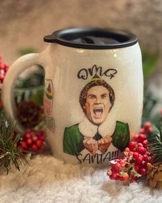 a coffee mug decorated with an image of the wizard on it, surrounded by holly and pine cones