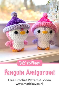 two small crocheted penguins sitting on top of a window sill