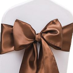 a chair with a brown bow on it