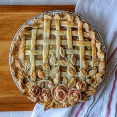 an apple pie on a wooden table