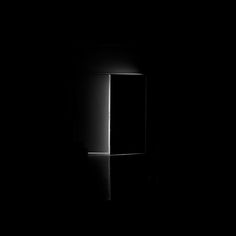 an open door is shown in the dark