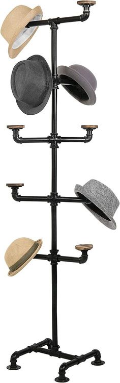 a hat rack with hats on it and four different colors in the same area,