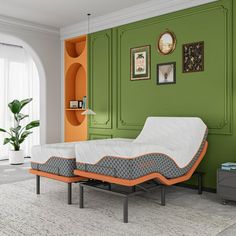 an orange and grey bed frame in a green room with white carpeted flooring