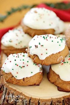 several cookies with white frosting and sprinkles