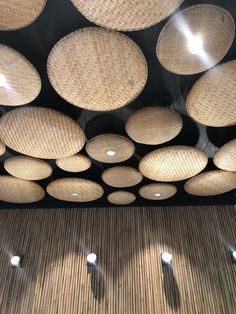 the ceiling is made up of woven wicker circles and round holes on each side