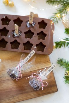 some chocolates are sitting on a cutting board