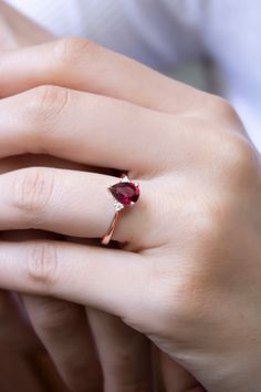 "\"Teardrop Cut Ruby Statement Ring with Diamonds | Red Ruby Gem Elegant Ring | 14k Gold Proposal Ring | Ruby Bride Wedding Ring \" Teardrop Cut Ruby 8k or 14K Solid Gold Ring with Diamonds, Perfect choice for engagement, wedding and statement. 2 diamonds used in the ring with real ruby. I can also make it with Sapphire Gemstone, please check below and contact me for details. https://www.etsy.com/listing/912308754 * Band Material: 8k/14k Solid Gold (Yellow, Rose and White options) * Gemstone: Di Pear-shaped Promise Rings For Valentine's Day, Pear-shaped Fine Jewelry For Wedding Gift, Valentine's Day Pear-shaped Fine Jewelry Rings, Valentine's Day Pear-shaped Fine Rings, Teardrop Yellow Gold Ruby Ring For Wedding, Solitaire Pear-shaped Jewelry For Proposal, Teardrop Gemstone Ring For Proposal, Rose Gold Teardrop Ring For Proposal, Yellow Gold Teardrop Ruby Ring For Anniversary