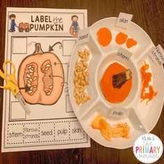 a paper plate with pumpkins and seeds on it next to a cutout of a pumpkin