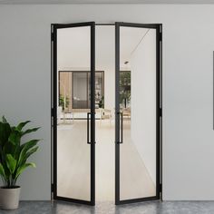 an open door leading to a living room with a potted plant in the corner