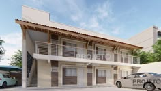 two cars are parked in front of a building with balconyes and balconies