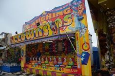 a carnival booth with lots of colorful items