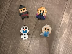 four pixel characters are sitting on the floor