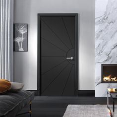 a modern living room with marble walls and flooring, including a black door that is open to the fire place