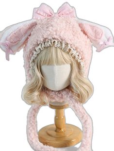 a wig with a pink hat on top of a mannequin's head