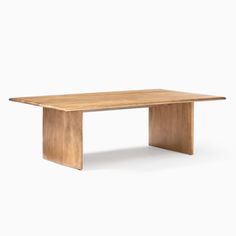 a wooden table sitting on top of a white floor