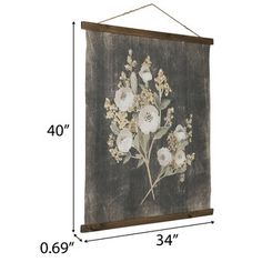 a wall hanging with flowers on it and measurements for the size of the frame below