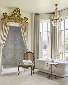 a fancy bathroom with marble floors and walls