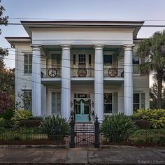 a large white house with columns on the front