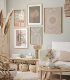 a living room filled with furniture and pictures on the wall