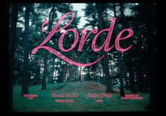 the title for lorde, written in pink on a dark background surrounded by trees