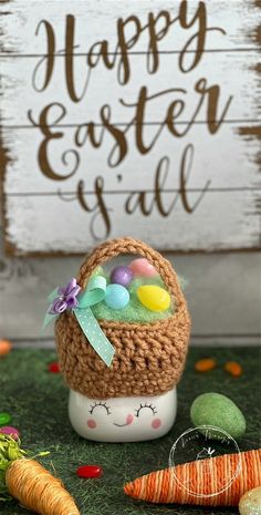 an easter basket with eggs and carrots in front of a sign that says happy easter y'all