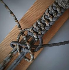 a close up of a rope on top of a wooden board