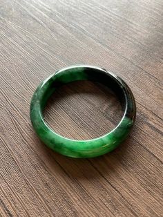 "🌈 Jade Bangle 59.7mm (2.35\"), Round Shape, Green & Light Green 🌷 Untreated Natural Jadeite/ Grade A Jade 🌷 Certification : Yes 🌷 Jade from Myanmar/ Burma 🌷 Shape : Round 🌷 Inner diameter : 59.7mm / 2.35\" 🌷 Width & Thickness : 14.2 x 8.8mm 🌷 Color : Green & Light Green 🌷 Free standard shipping from Hong Kong with tracking included 🌷 Take approximately 7-21 days to arrive worldwide ❤️ In Chinese Culture: Young people wear jade pendant will have a prosperous life, attracts Adjustable Carved Round Bracelets, Adjustable Carved Bracelets, Carved Jade Round Bracelets, Carved Jade Bracelets, Jade Gemstone Bangle Jewelry, Jade Gemstone Bangle Bracelet, Carved Jade Bangle Bracelet, Handmade Round Jade Bangle, Green Carved Bangle Bracelet