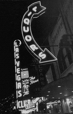 an old black and white photo of a neon sign for the famous las vegas hotel