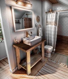 a bathroom with a sink, toilet and mirror