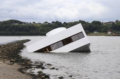 a large white object floating on top of a body of water