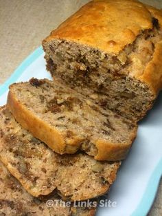 sliced loaf of banana nut bread on a blue and white plate