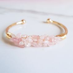 Rose Quartz Crystal Jewelry Adjustable Gemstone Bracelet Handcrafted and Wire-Wrapped Suitable for Small to Medium size wrists Available in 18K Gold-Plated or Sterling Silver Plated Base Rose Quartz Properties: Love, Romance, Self-Love, Friendship, Kindness, Peace, Compassion Rose Quartz Accessories, Pink Jewerly, Moodboard Pictures, Pink Quartz Jewelry, Pink Quartz Bracelet, Fantasy Accessories, Rose Quartz Properties, Bracelets Gemstone, Quartz Properties